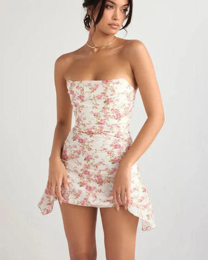 Front angled view of a floral strapless mini dress showing ruched bodice and asymmetrical hem