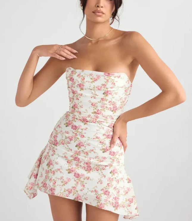 Front view of a floral mini dress with strapless neckline, fitted waist, and flowing side panel