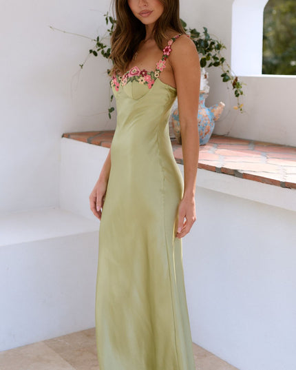 Side view of sage green floral sweetheart maxi dress with fitted bodice and skirt
