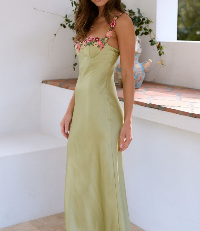 Side view of sage green floral sweetheart maxi dress with fitted bodice and skirt