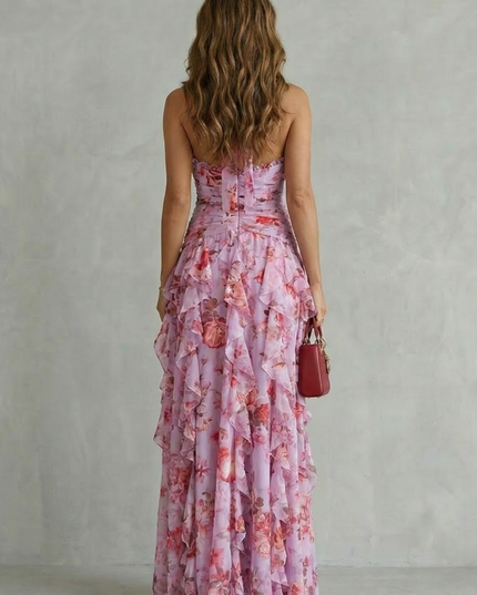 Back view of pink floral halter maxi dress with open back and ruched bodice detail