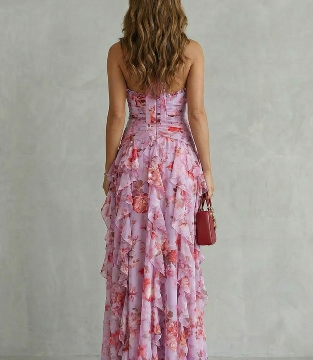 Back view of pink floral halter maxi dress with open back and ruched bodice detail