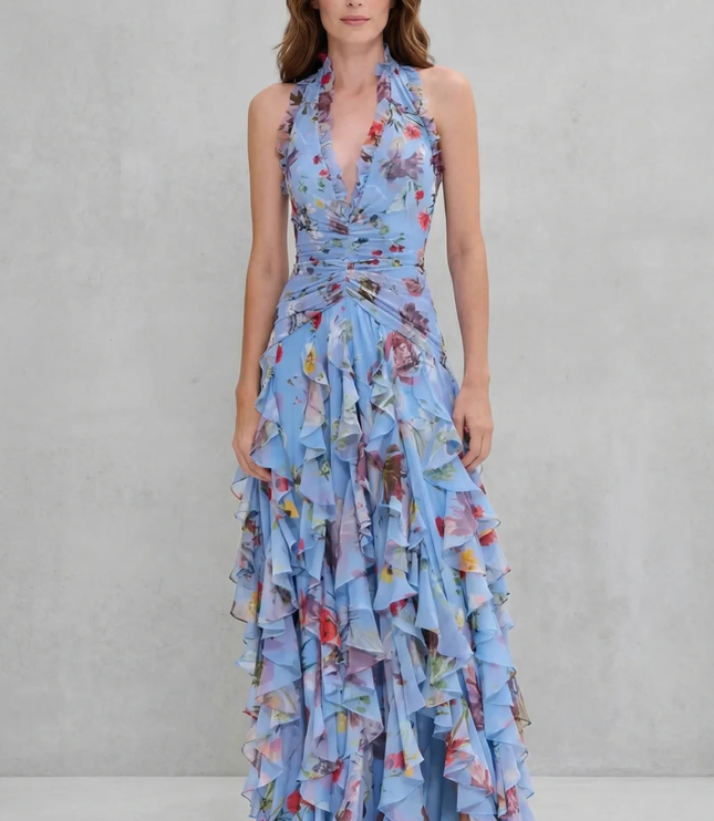 Front view of blue floral halter maxi dress with ruched waist and cascading ruffles