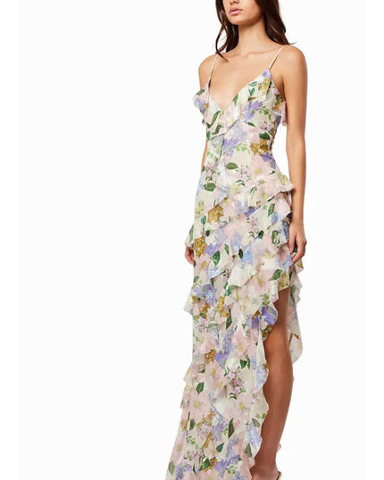 Side view of a floral wedding guest maxi dress with V neck, thin straps, and high slit