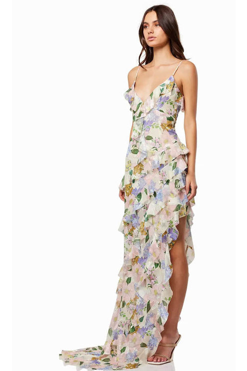 Side view of a floral wedding guest maxi dress with V neck, thin straps, and high slit
