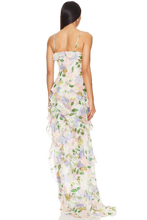 Back view of a floral maxi dress with spaghetti straps and a flowing layered skirt