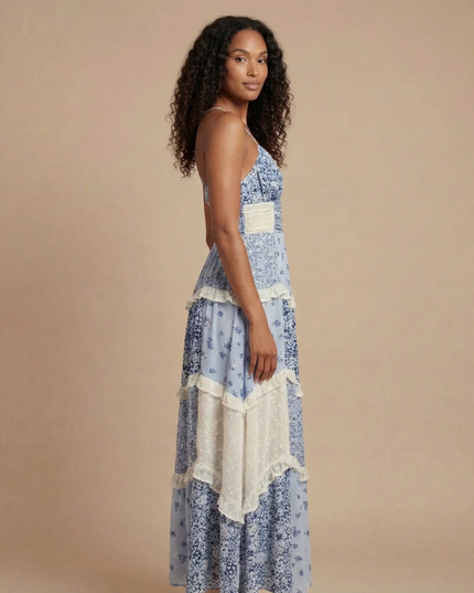 Blue floral maxi dress with v-neck, cream waistband, and mixed print tiered skirt