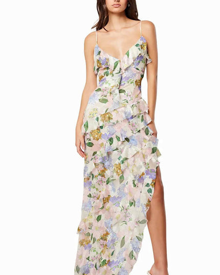 Full length floral maxi dress with V neckline, asymmetrical ruffles, and side slit