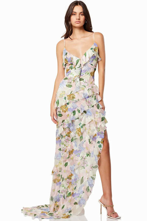 Full length floral maxi dress with V neckline, asymmetrical ruffles, and side slit