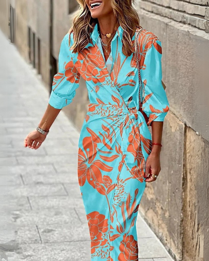 Turquoise wrap midi dress with red floral print and rolled sleeves