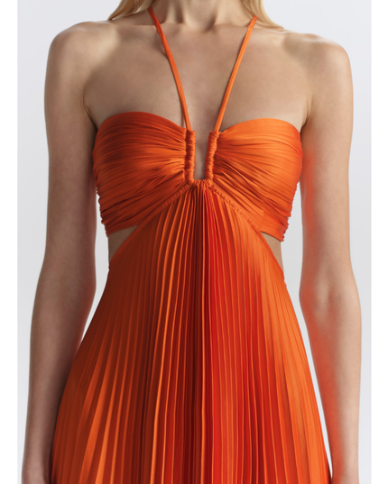 Close-up of orange halter neckline with ruched bust and pleated center panel on maxi dress