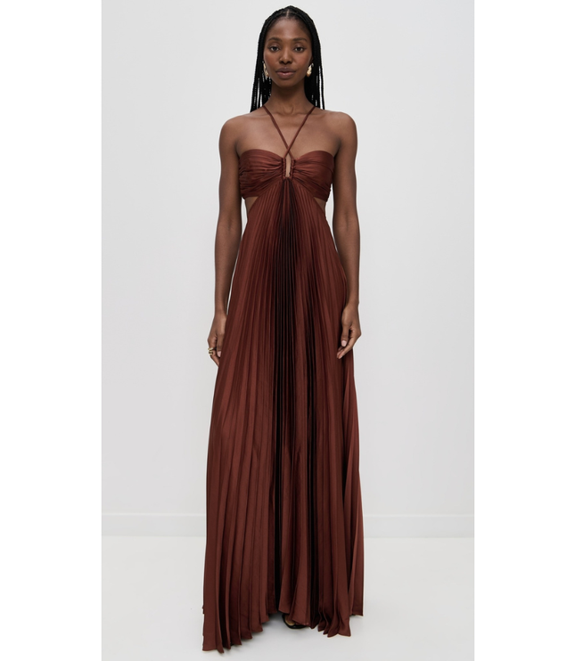 Front view of rust brown wedding guest halter maxi pleated dress with ruched bust and flowy skirt