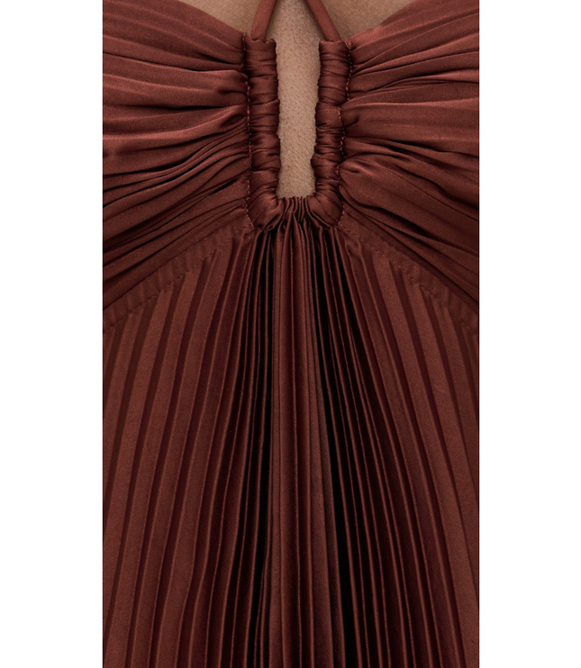 Detail of rust brown pleated maxi dress showing ruched center front keyhole and fine pleats