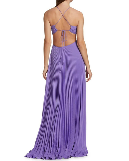 Back view purple halter maxi pleated dress showing crisscross straps, open back, and long pleated skirt