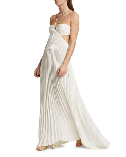 Ivory halter maxi pleated dress side view showing cutout waist and flowing skirt hem