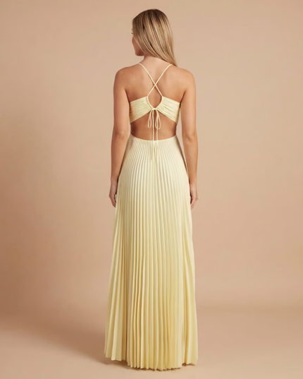 Back view of cream halter maxi dress showing tied halter straps and open back