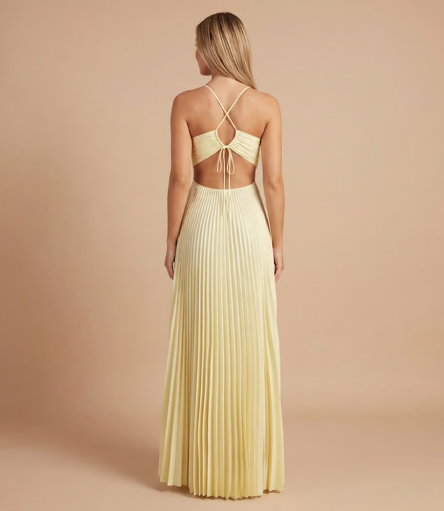Back view of cream halter maxi dress showing tied halter straps and open back