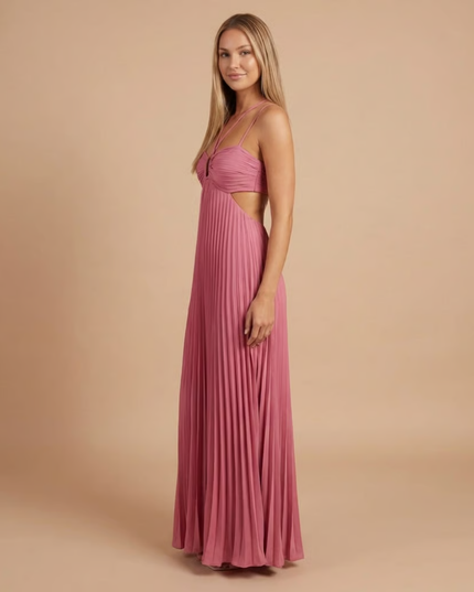 Side view of mauve pink halter maxi dress showing pleated skirt and side cutout