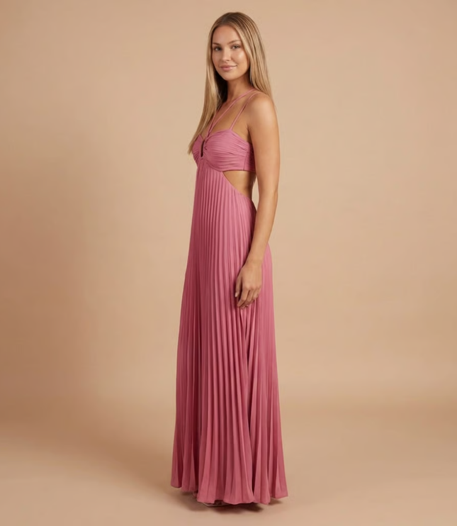 Side view of mauve pink halter maxi dress showing pleated skirt and side cutout