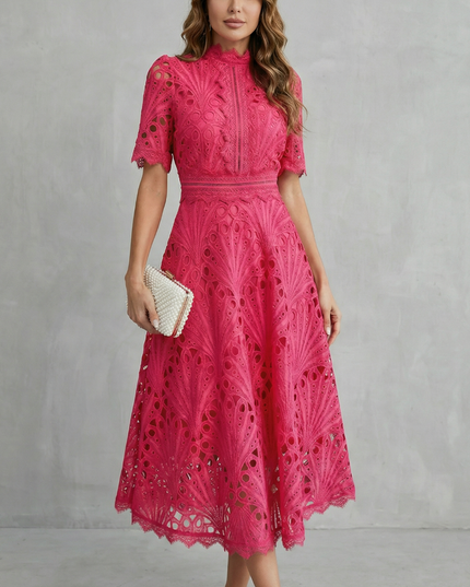 Front view of pink wedding guest lace midi dress with high neck and fitted waist