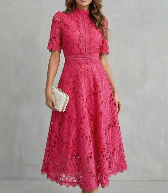 Front view of pink wedding guest lace midi dress with high neck and fitted waist