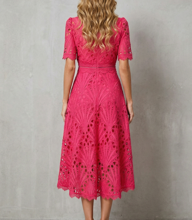 Back view of pink lace wedding guest midi dress with zip closure and scalloped hem