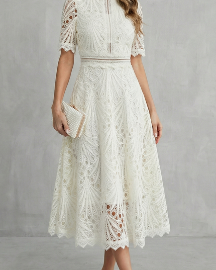 Ivory lace high neck midi dress with short sleeves and sheer patterned skirt for wedding guest
