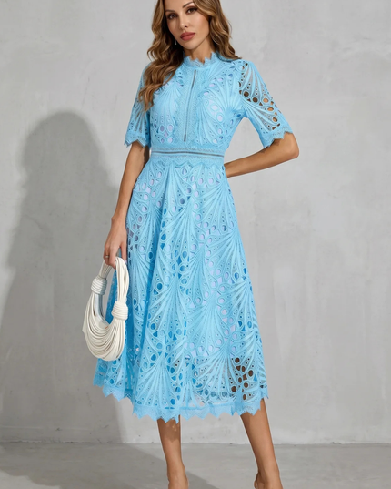 Front view of light blue wedding guest lace midi dress with high neck and sheer cutout details