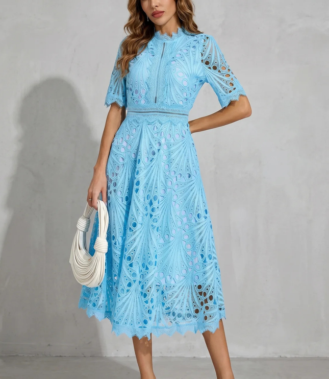 Front view of light blue wedding guest lace midi dress with high neck and sheer cutout details