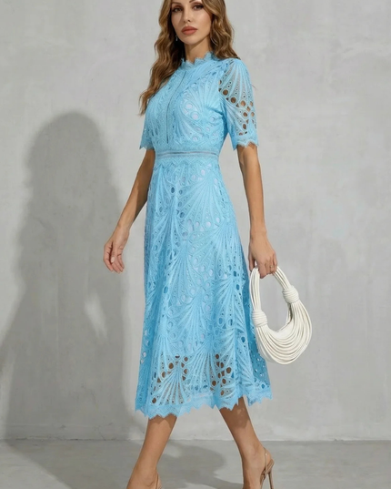 Side view of light blue lace midi dress with high neck, short sleeves, and flowing skirt
