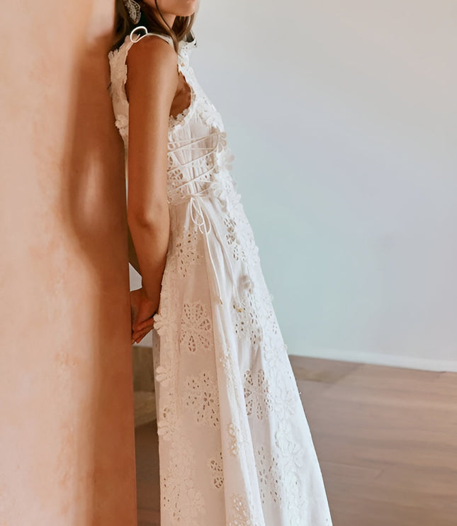 Back view of white eyelet maxi dress showing lace-up corset detail
