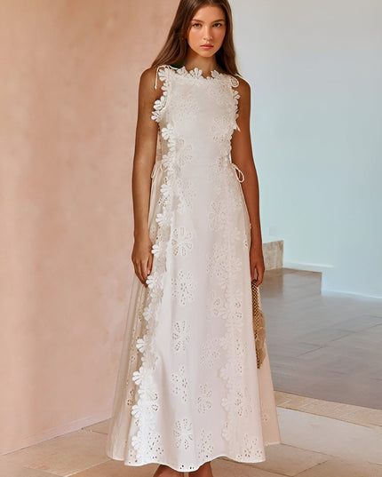 White eyelet lace maxi dress with ruffled trim and lace-up side detail