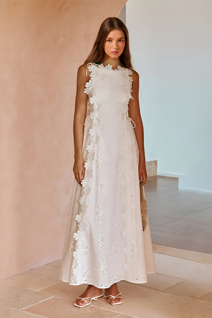 White eyelet lace maxi dress with ruffled trim and lace-up side detail