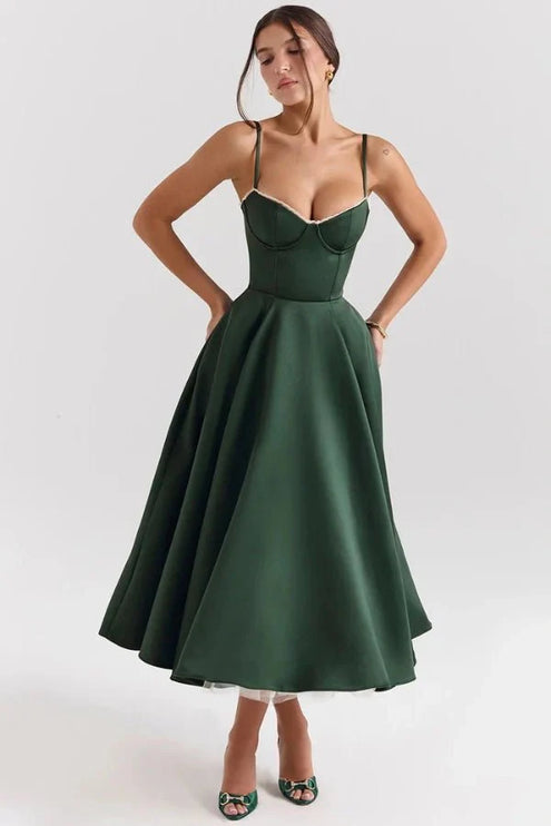 Front view of dark green midi dress with fitted bodice and flared skirt for a wedding guest look