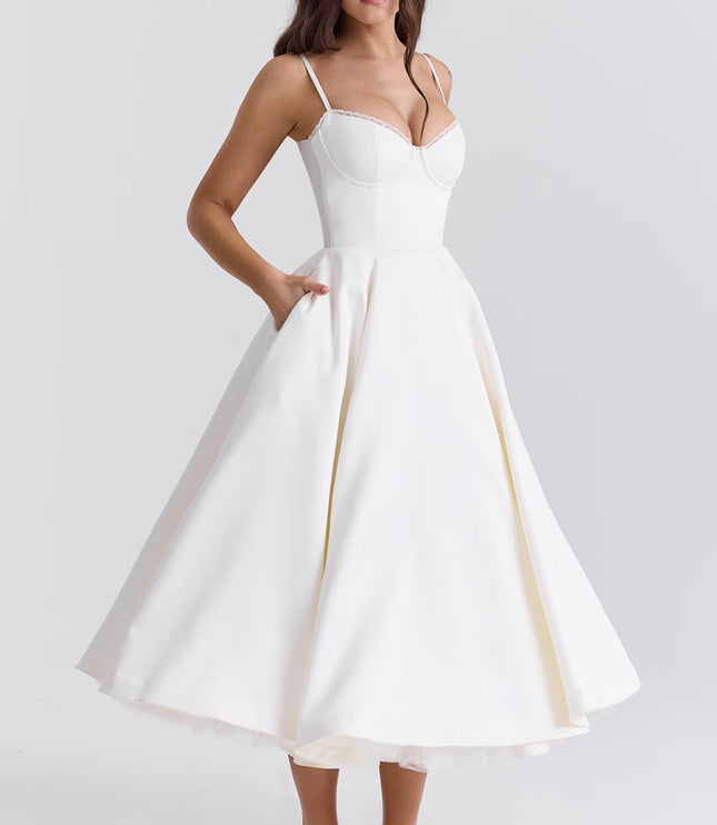 White midi wedding guest dress with spaghetti straps, fitted bodice, and full skirt
