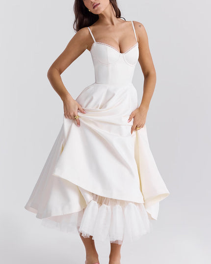 White midi dress with layered skirt and spaghetti straps for wedding guest