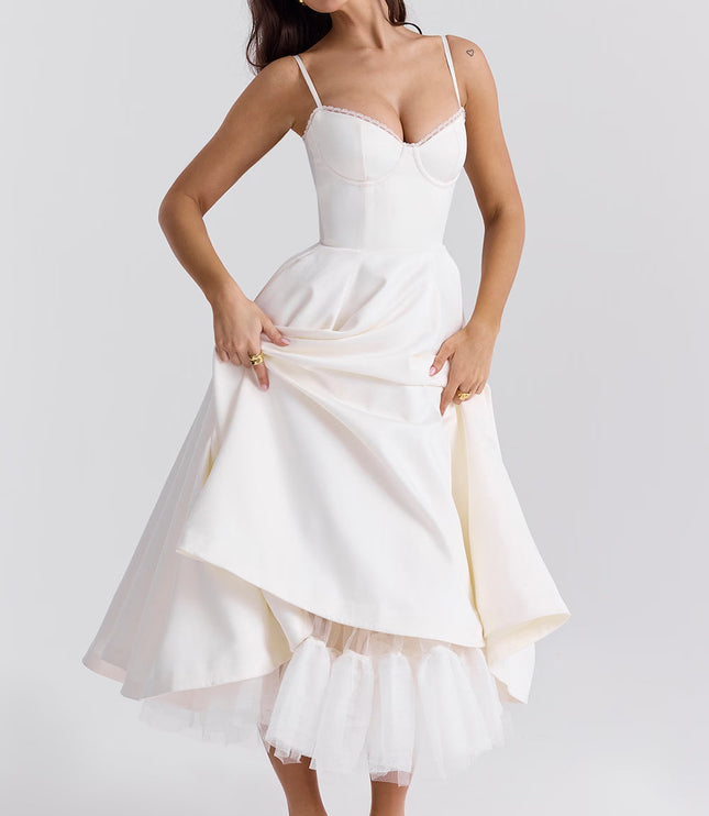 White midi dress with layered skirt and spaghetti straps for wedding guest