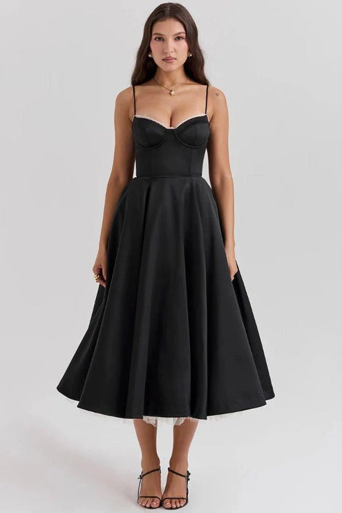 Black midi dress with corset bodice and full skirt for wedding guest