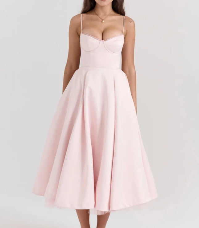 Blush pink midi dress with spaghetti straps and full skirt for wedding guest
