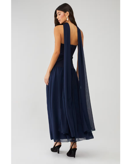 Back view of navy strapless maxi dress with open back and long sheer scarf detail