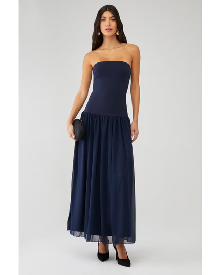 Navy strapless wedding guest maxi dress with fitted bodice and full sheer skirt