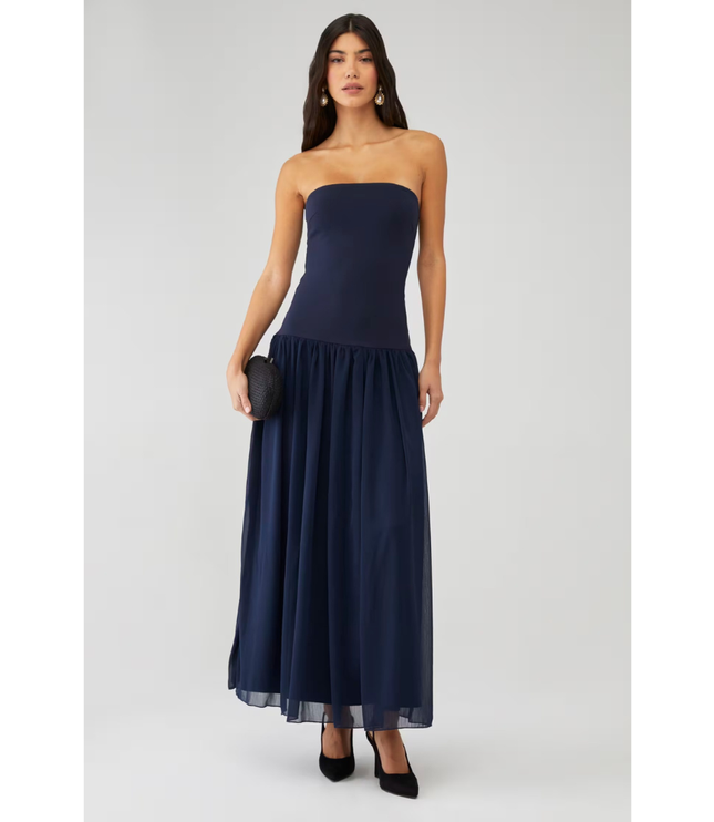Navy strapless wedding guest maxi dress with fitted bodice and full sheer skirt