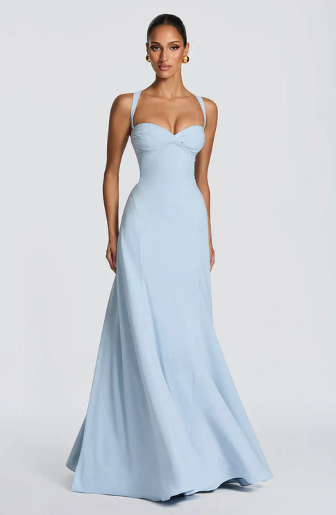 Side view of light blue maxi dress with fitted waist and full floor-length skirt