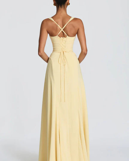 Back view of lemon yellow maxi dress with crisscross straps and lace-up bodice detail