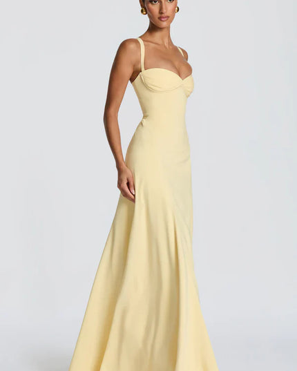 Side view of lemon yellow maxi dress with straps and softly flared skirt