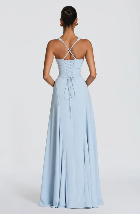 Light blue maxi dress with sweetheart neckline and flowing skirt for wedding guest style
