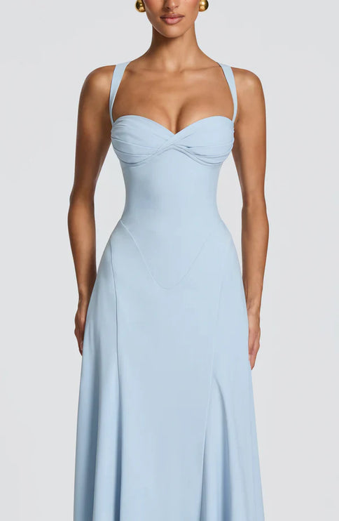 Back view of light blue maxi dress with crisscross straps and lace-up back detail