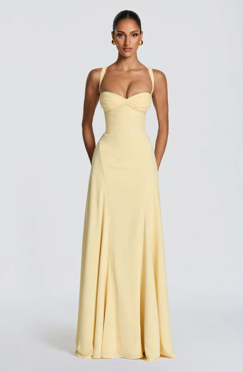 Lemon yellow maxi dress with sweetheart neckline and flowing skirt for wedding guest wear