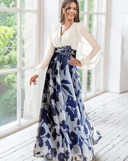 Cream v-neck maxi dress with navy floral skirt and draped sleeves