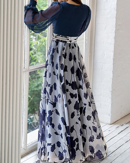 Back view of navy and white floral maxi dress with flowing skirt